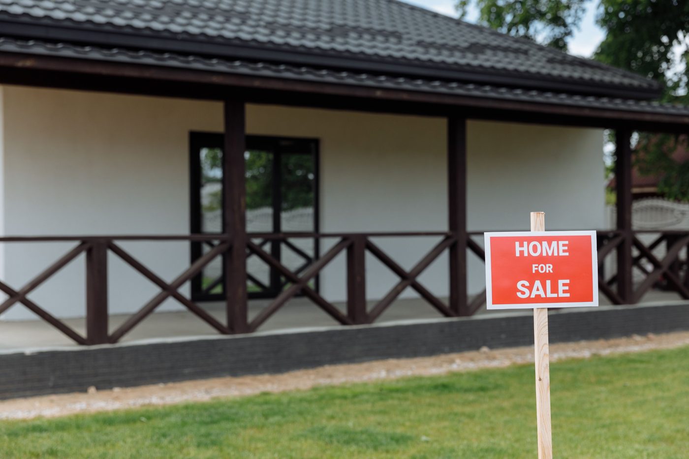 Single-story home with a Home for Sale sign in the front yard